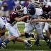 Pioneer senior running back Zachary Davis pushes for extra yards against Dexter defenders Friday. Pioneer defeated Dexter 69-0.  Daniel Brenner I AnnArbor.com